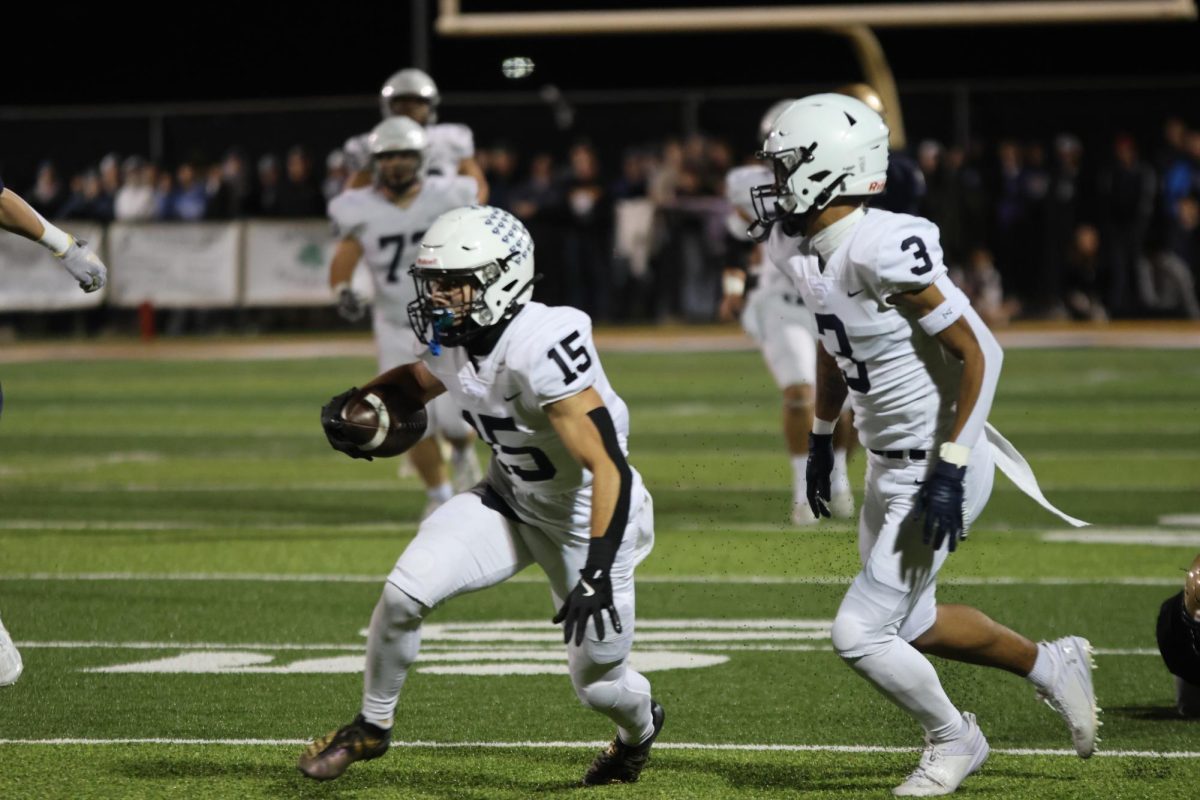 Senior Andy Watts looks for someone to complete his pass.