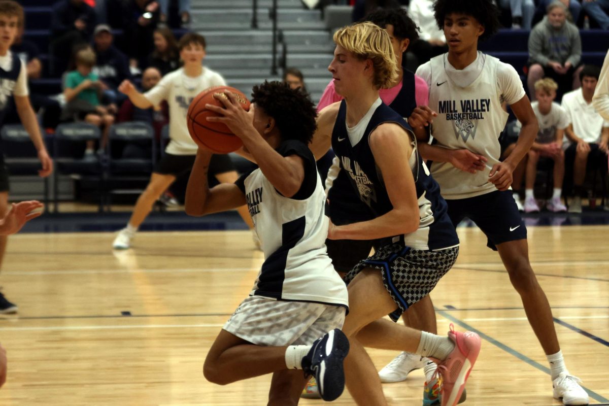 Junior Daniel Davis gets passed a defender for the open lay up in a scrimmage Friday, Dec. 6. 