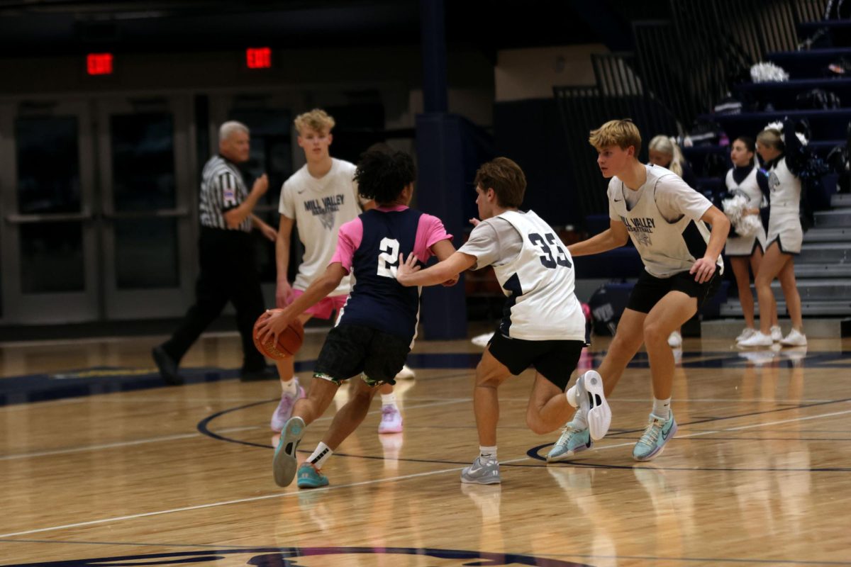 Junior Jakhai Carter breaks past defense and drives to the basket in a scrimmage Friday, Dec. 6