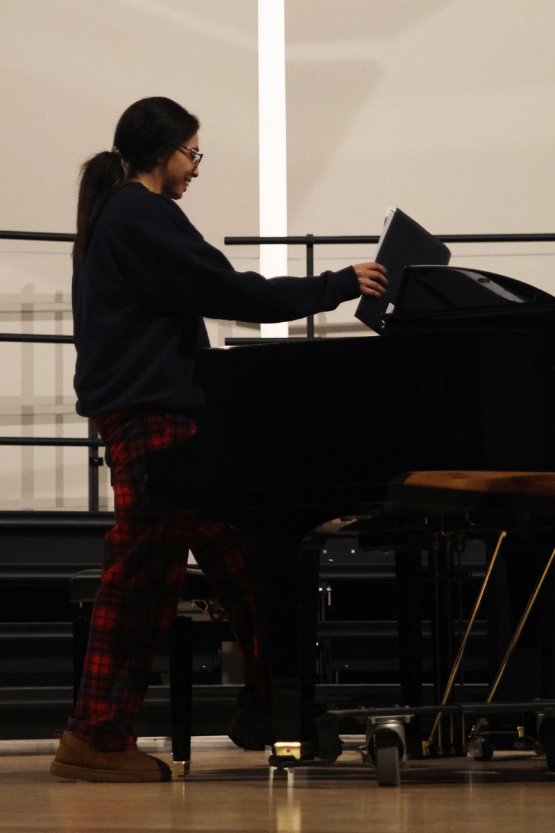 Placing her music down, senior Kenzie Johnson gets ready to play her song.