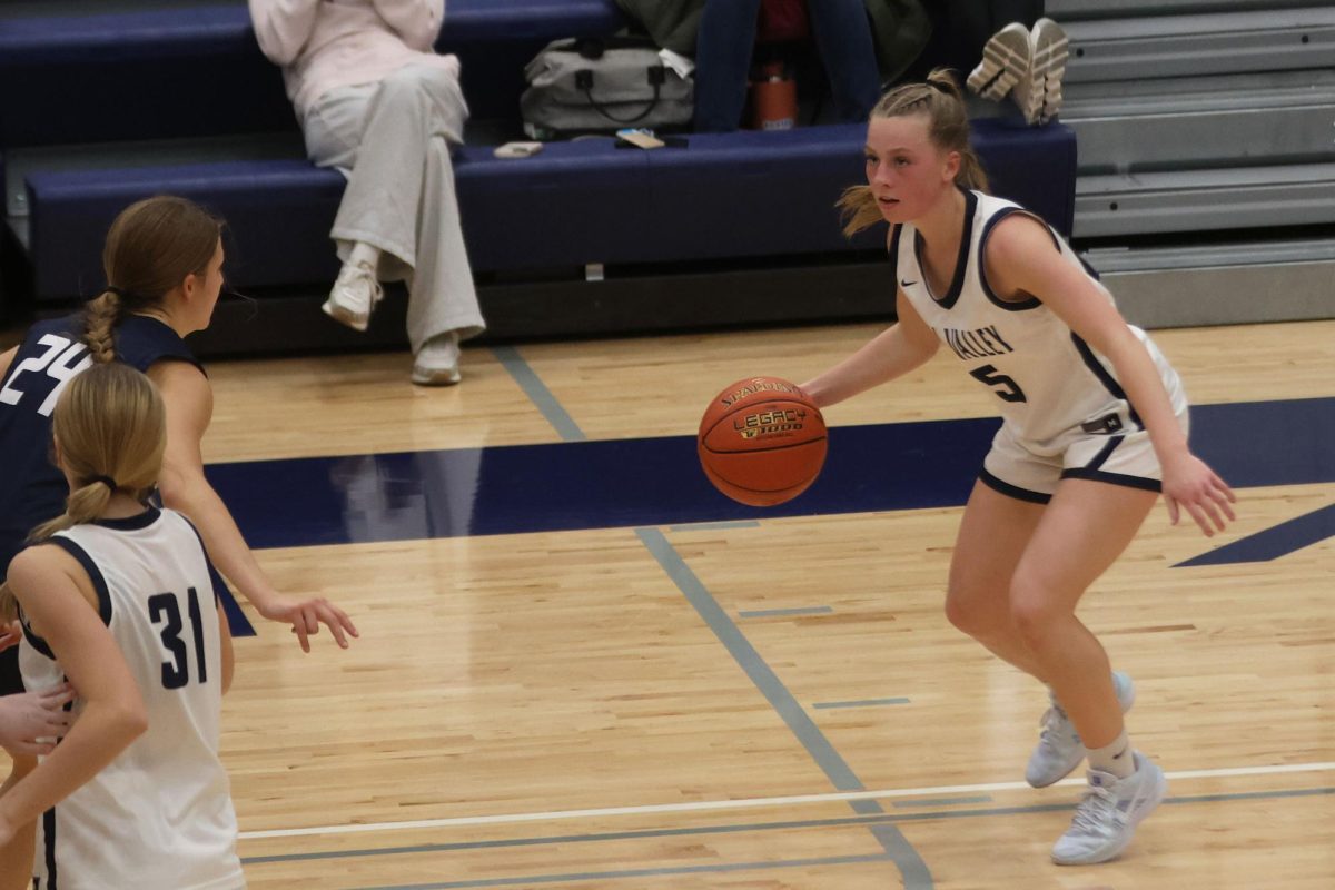 Senior Josie Benson looks for an opening to pass the ball to her teammate during the scrimmage. 
