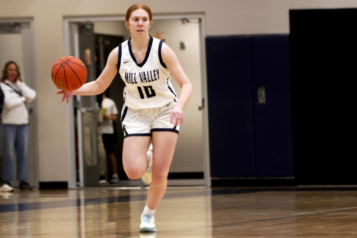 Junior Leah Konen dribbles the ball down the field during the second quarter of the game.