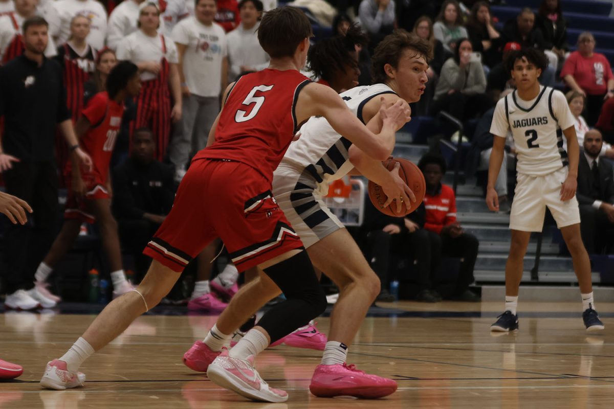 Looking for some help, junior Reece Riedel  tries to get pass his defender. 