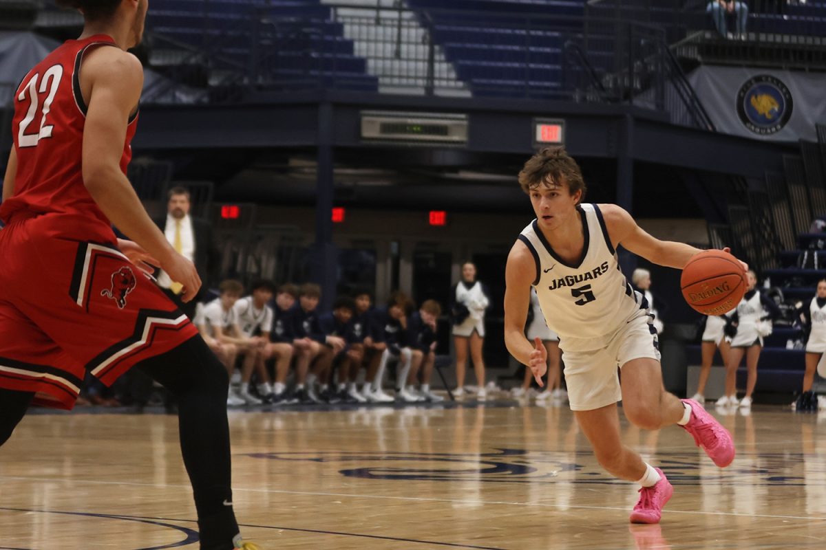 Running to the basket, junior Reece Riedel  looks for an opening. 