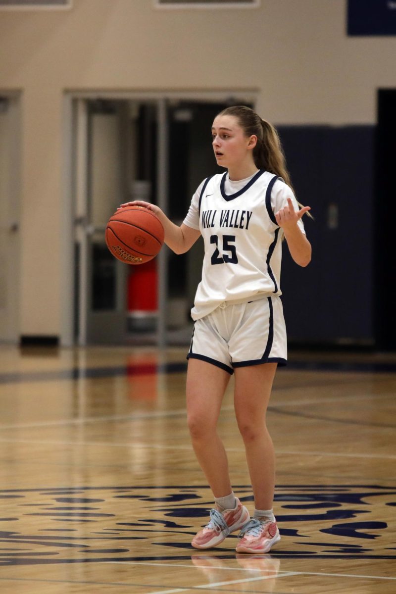 Yelling out to their team, sophomore Riley Marshall calls out the play.