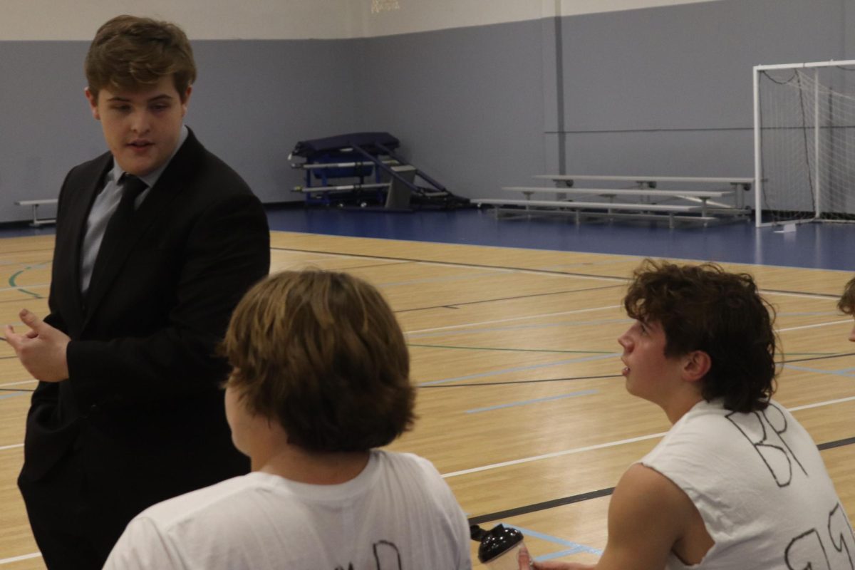 Seniors Hank Danielson talks strategy with his players.