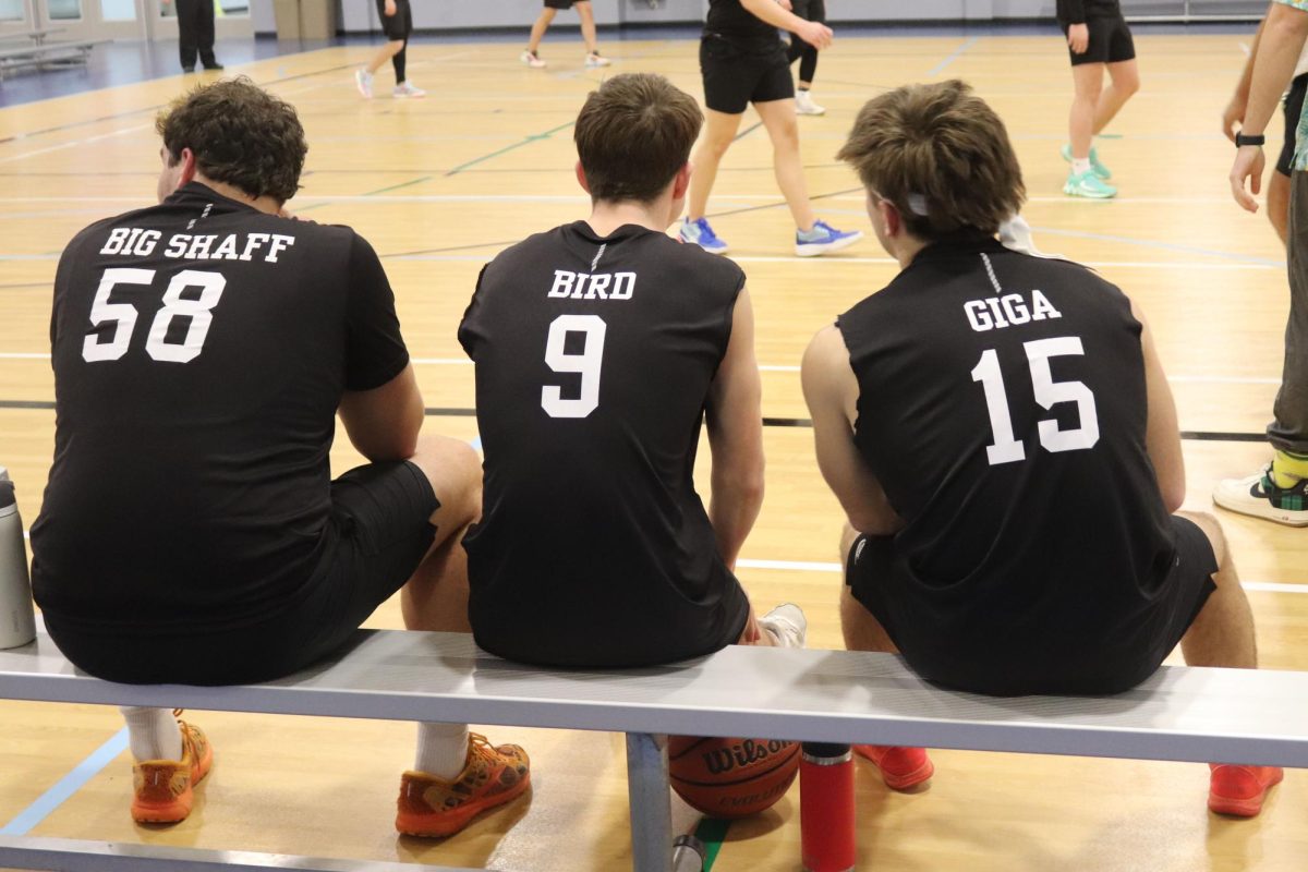 Seniors Abe Shaffer, Colby Eckhoff, Andy Watts all sharing the bench waiting to go into the game.