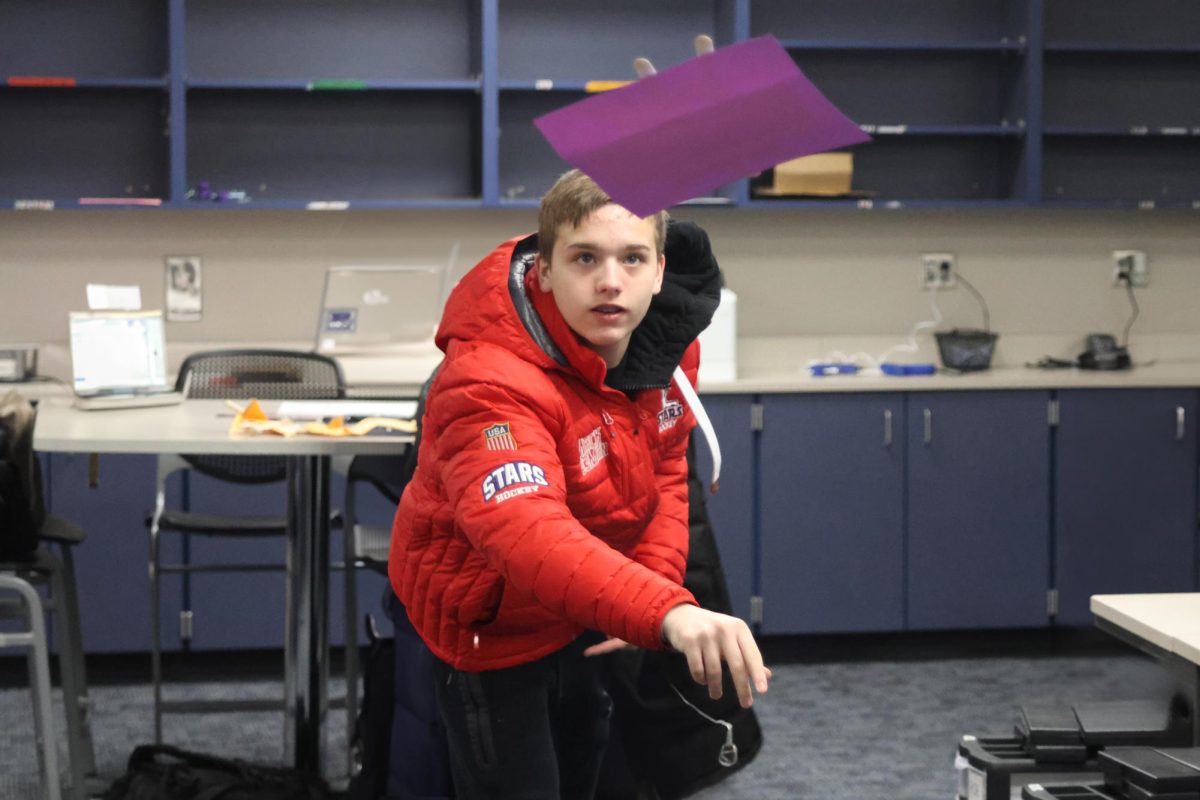 Freshman MachKennen Pinney steps forward, attempting to throw his team’s plane to the 15ft mark.