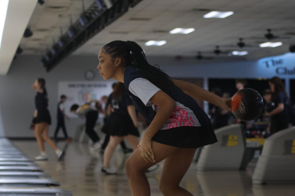 Ball in hand, freshman Baileigh Rodriquez rolls the ball down the lane. 