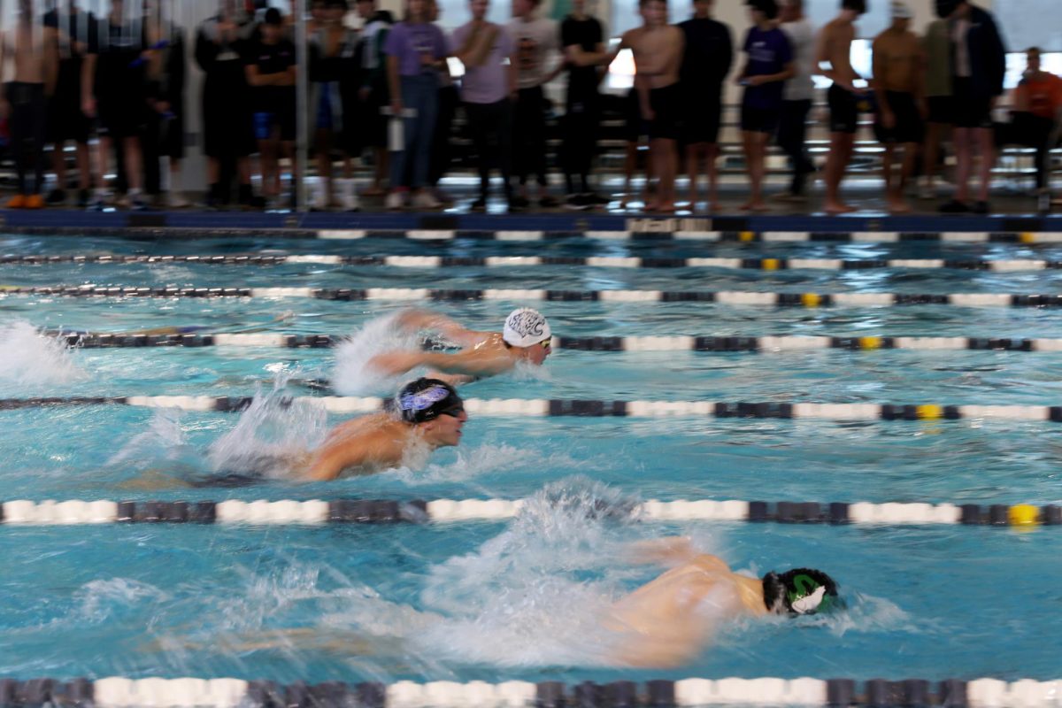 In the lead, senior Carson Reynolds competes in the 100 yard butterfly. 
