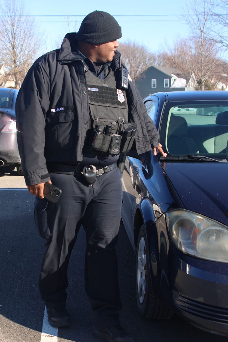 Checking the cars, School Resource Officer Hillman does his checking rounds around the school parking lot to make sure people are parking in the right places, Thursday, Jan 16.
