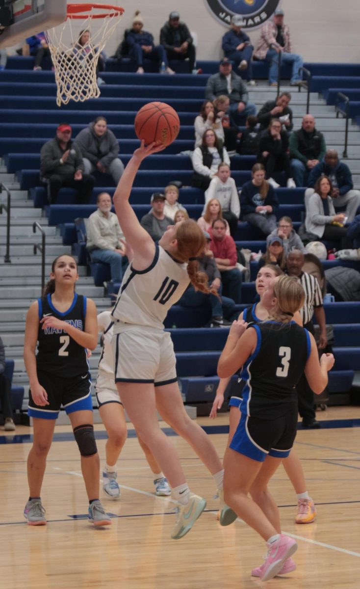 Shooting the ball, junior Leah Konen goes for the layup.
