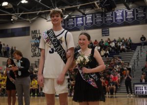 Smiling toward the crowd, seniors Carter Kaifes and Reese Miller are crowned Winter Homecoming King and Queen.