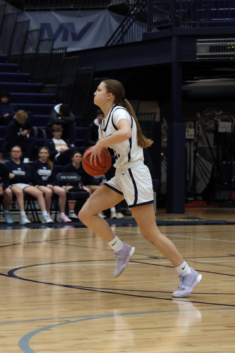 Looking down the court, senior Averie Landon looks to pass the ball.