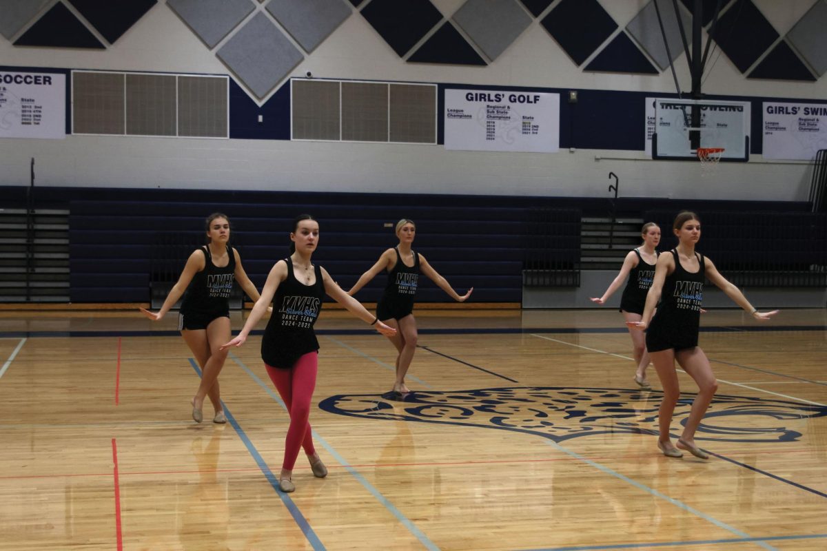 The dance team splits into two groups, working on different choreography on Jan. 15