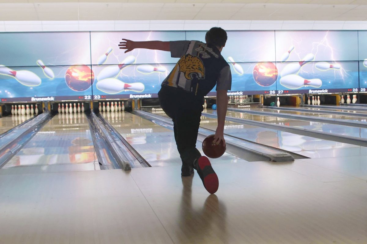 With good technique, sophomore Hudson Berg throws the ball aiming for a strike, Tuesday, Feb. 4.