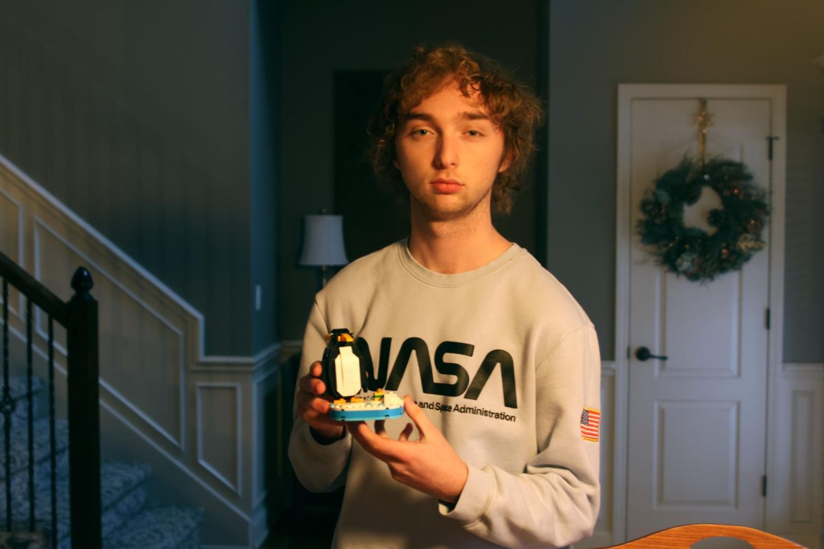 Showing off his penguin lego, junior Hayden Kelo says that legos are nice to build and you are able to display them when you are finished, Thursday, Jan. 30