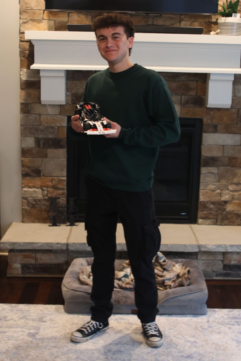 Holding one of his car lego sets, senior Michael Handlin describes building lego sets as a good way to build problem solving skills, Friday, Jan.31.