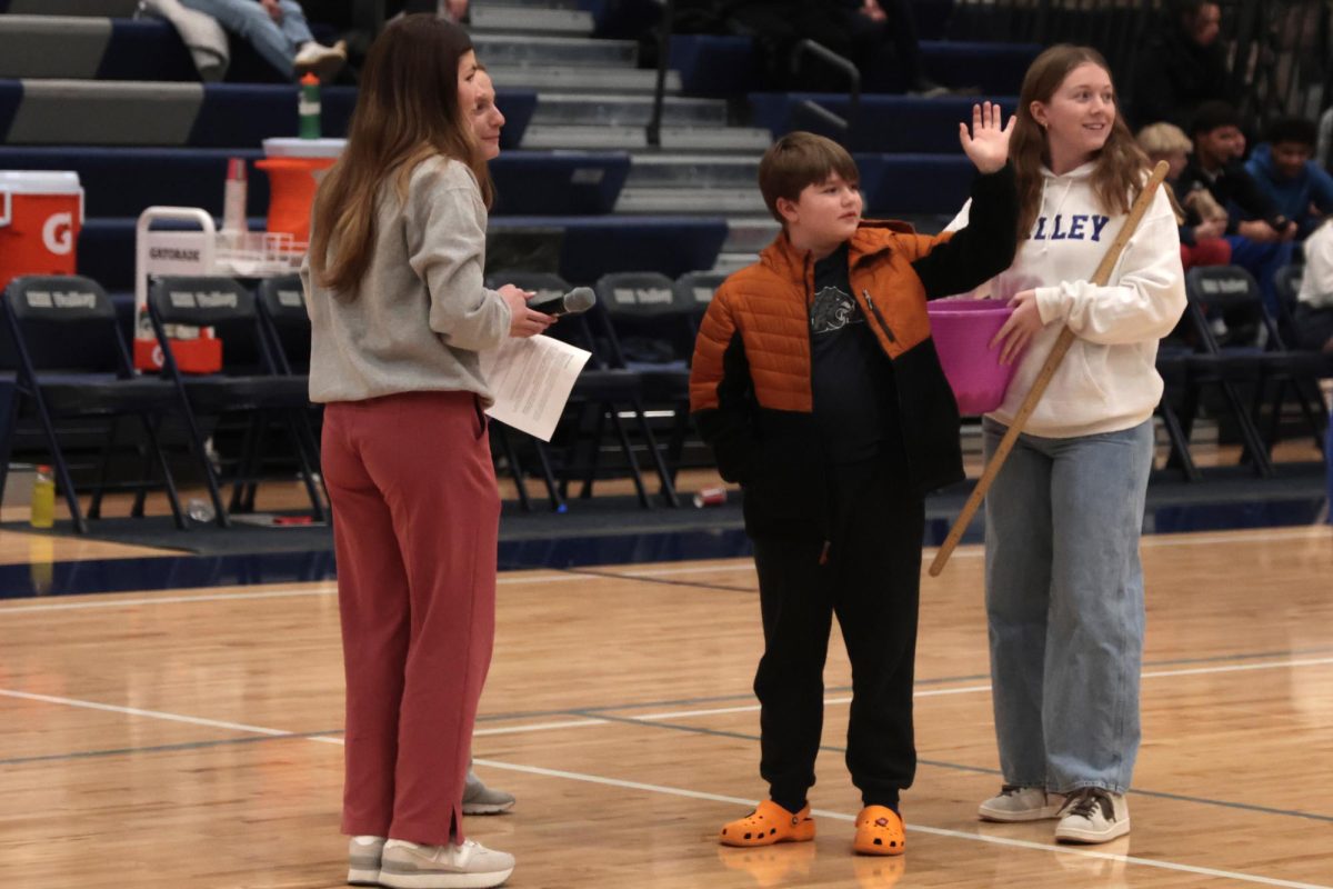 Seniors Meg McAfee, Brynn Shideler, and Elly Hayes congratulate the winner of the Relay for Life ‘Chuck a Duck’ contest.