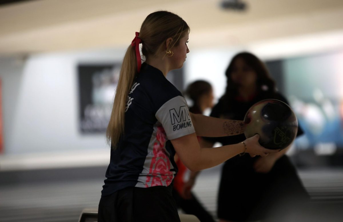 Focused, junior Abby Haney prepares to roll the ball. 