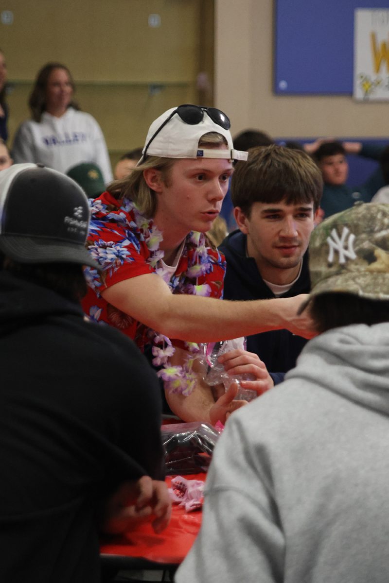 Pointing, senior Clayton Sondgeroth communicates with his team.