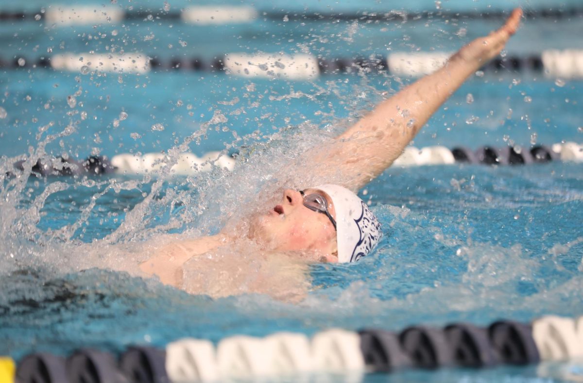 With his arm up in the air, sophomore Andy Buchwitz reaches for a breath of air.
