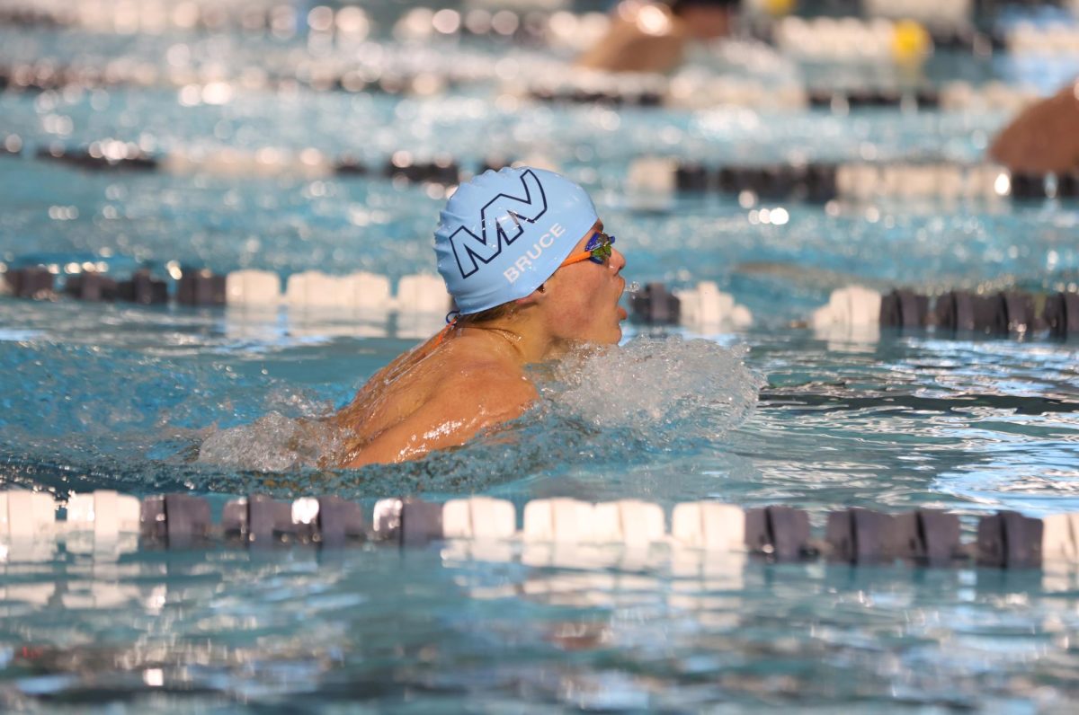 Taking a breath of air, sophomore Turner Bruce makes it to the end of the lane. 
