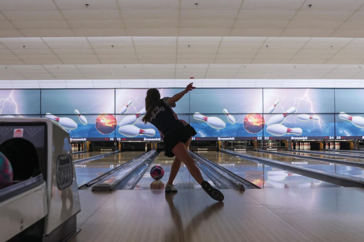 Following through junior Layla Gonzalez watches the ball. 