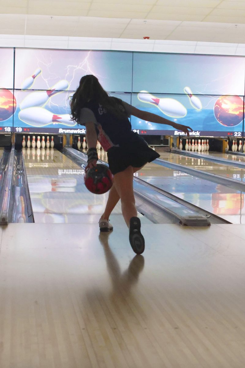 With good technique, junior Layla Gonzalez focuses on throwing the ball at the perfect angle and speed for a strike, Tuesday, Feb.4.