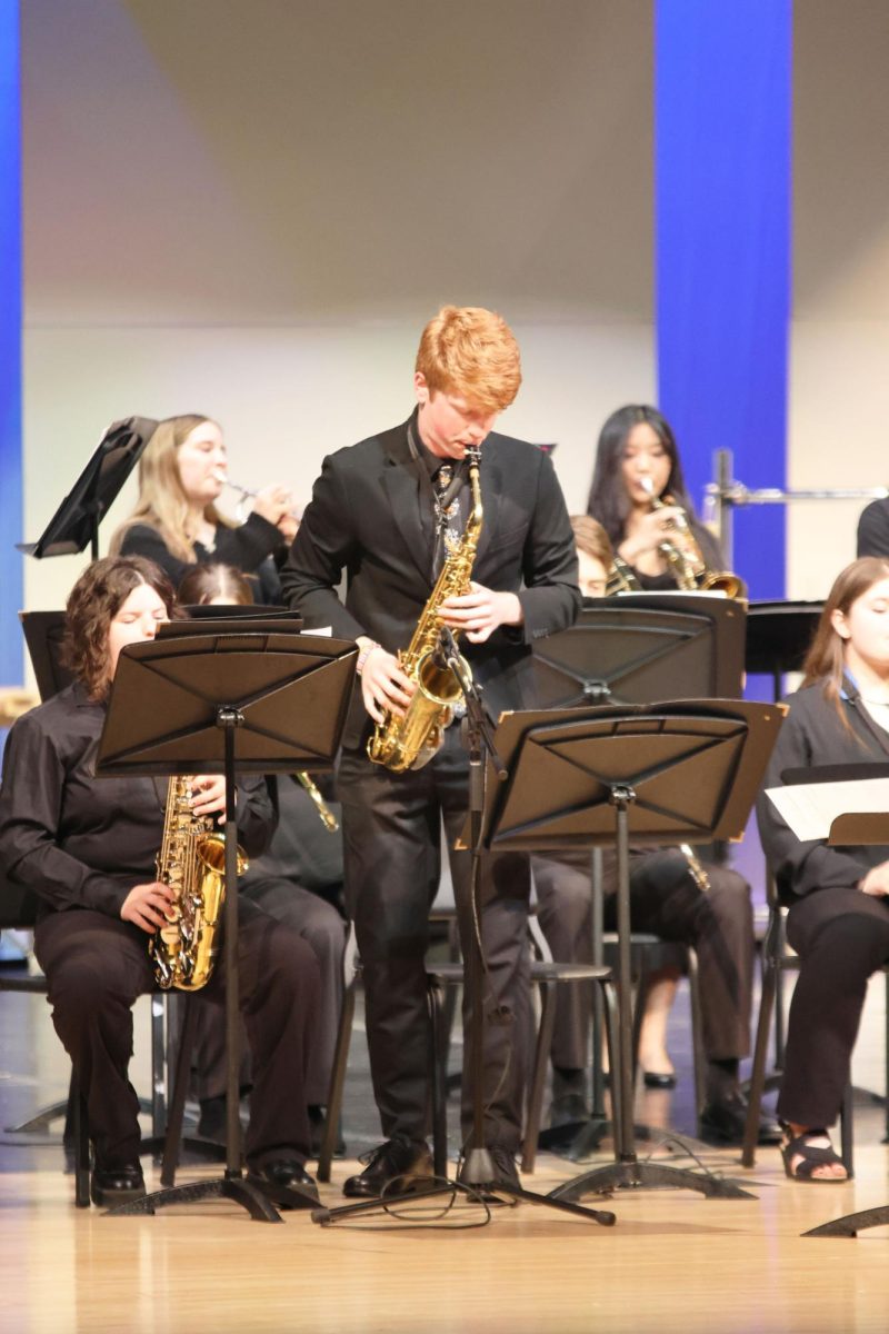 Senior Brayden Evans stands in front of the crowd to play his solo