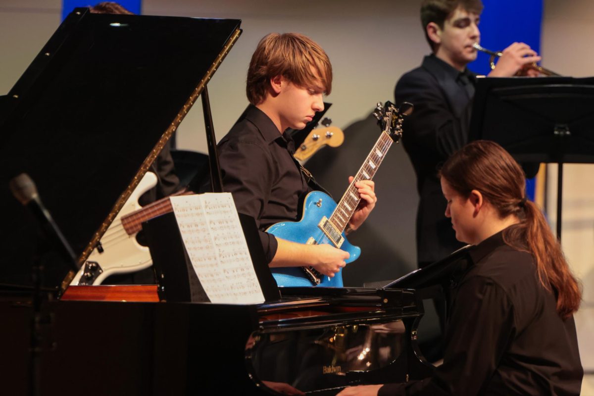 Playing in tandem, seniors Kaitlyn Fitzpatrick and Zach Chesser lead a song for jazz band.  
