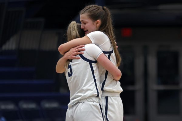 After the Jags' loss, seniors Averie Landon and Josie Benson hug each other. 