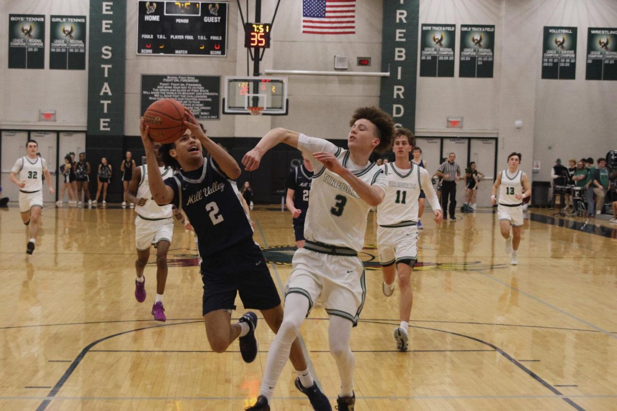 Junior Jakhai Carter takes a hard foul as he's going up for a shot