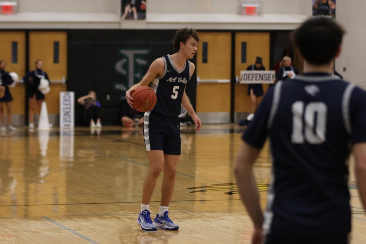 Junior Reece Riedel crosses over, ready to challenge a defender