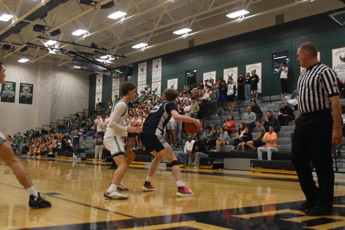 Senior Carter Kaifes backs down a defender, looking to go to the basket