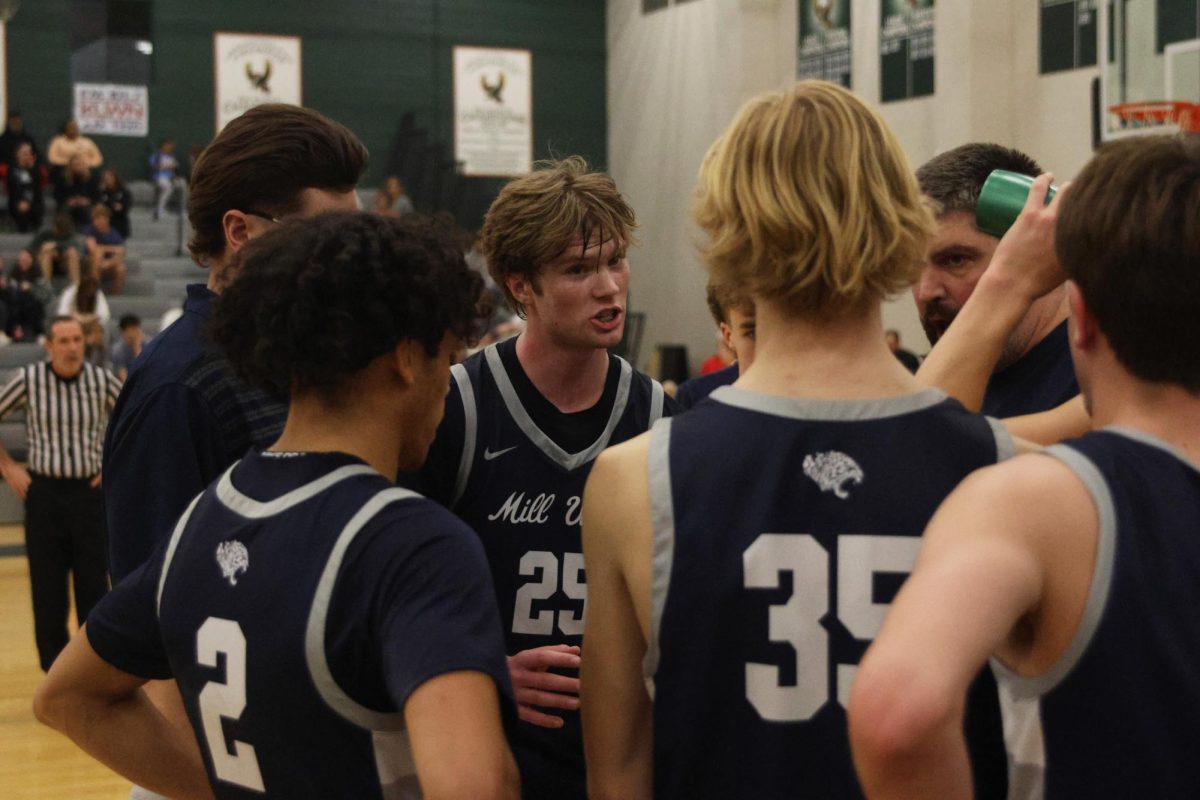 Senior Carter Kaifes talks about the game plan while in a timeout