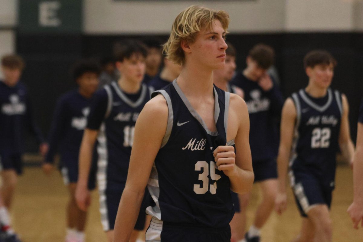 Junior Dylan Everhart walks off the court after beating Free State