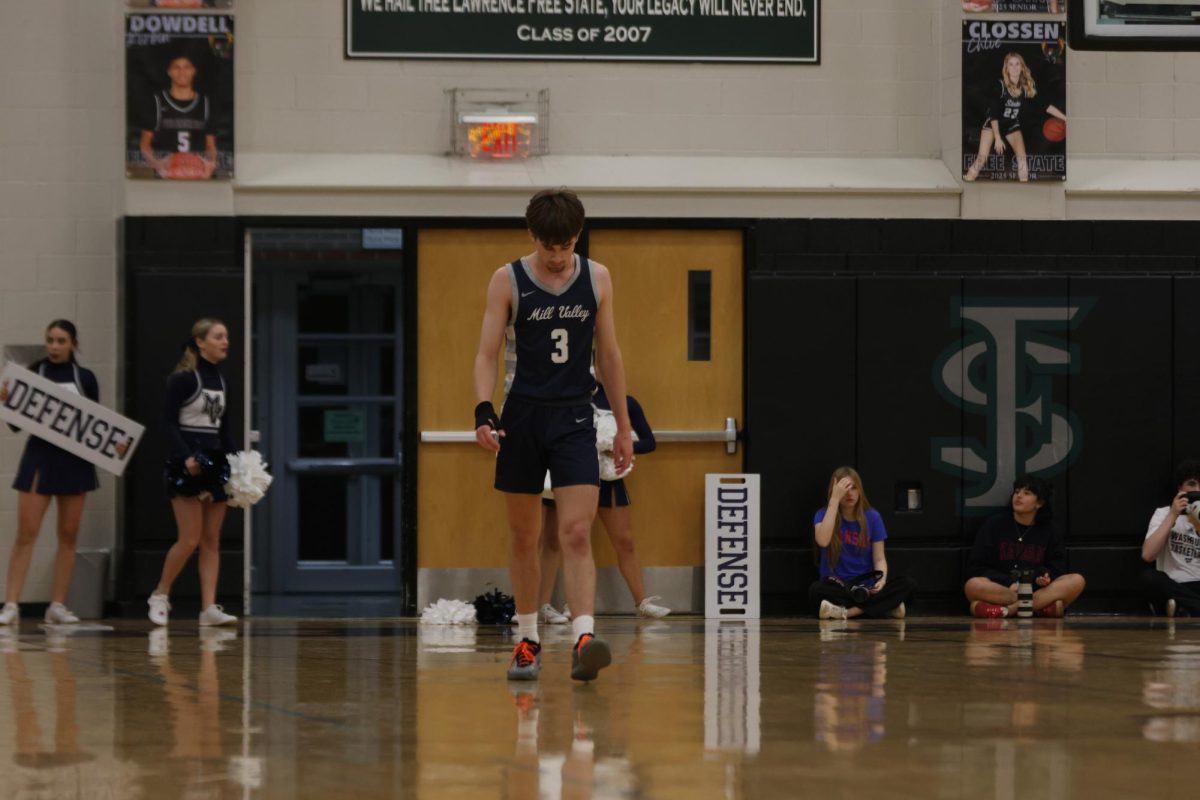 Senior Thatcher Ivey walks down the court, preparing for offense