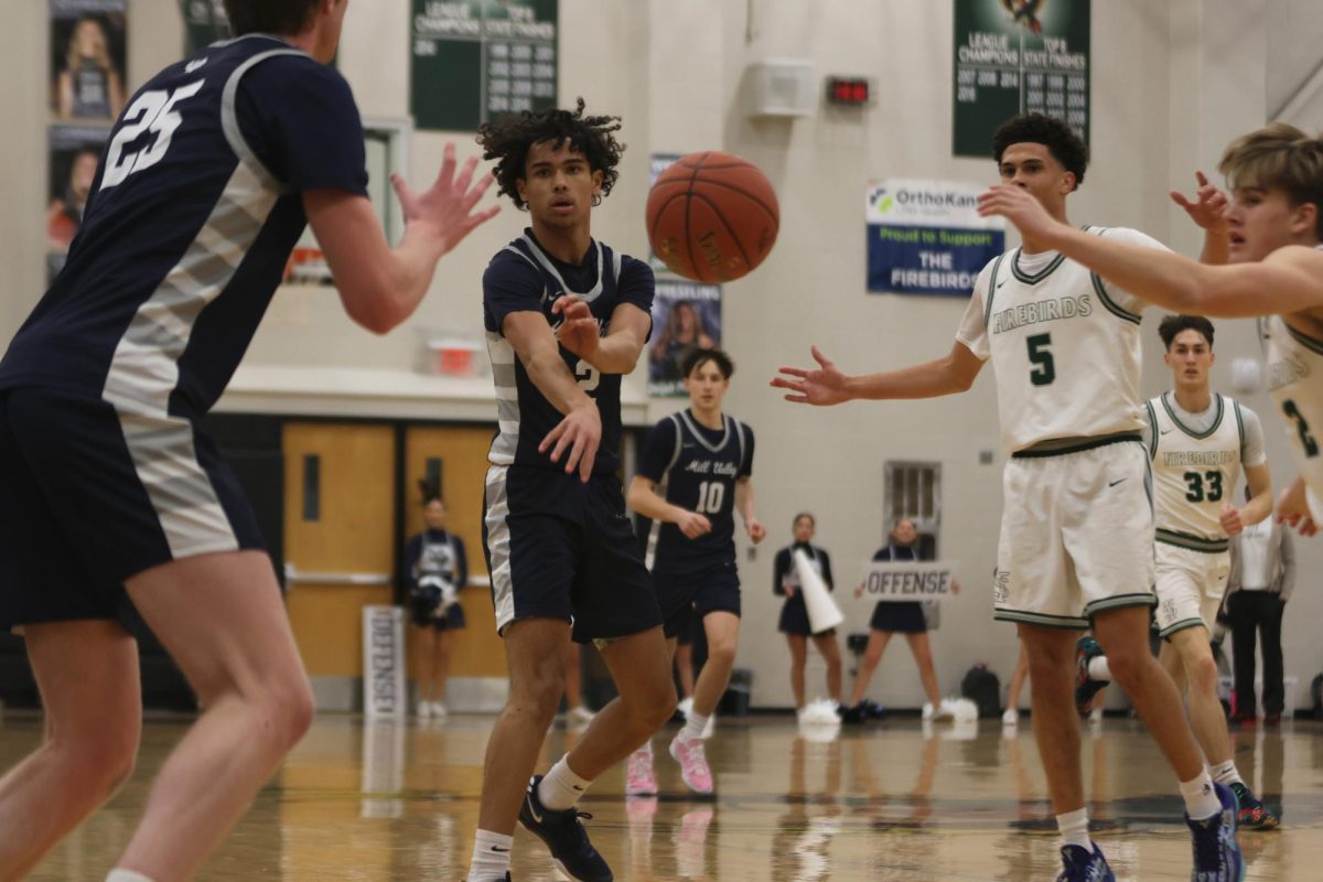 Junior Jakhai Carter sends a quick pass to his teammate