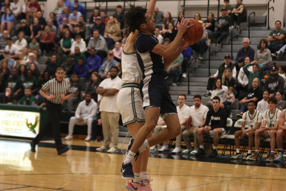 Junior Jakhai Carter goes up for a contested layup, drawing a foul