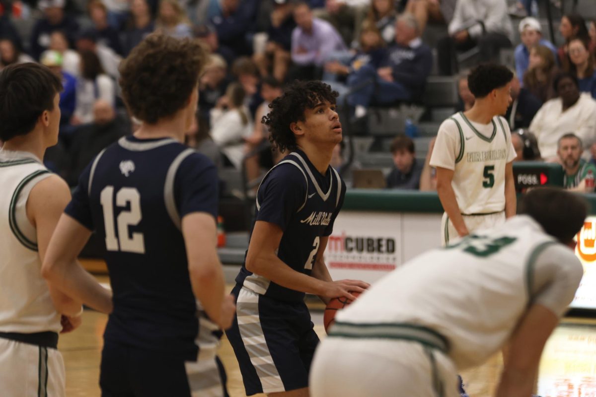 Junior Jakhai Carter stands at the free-throw line, ready to take his first shot