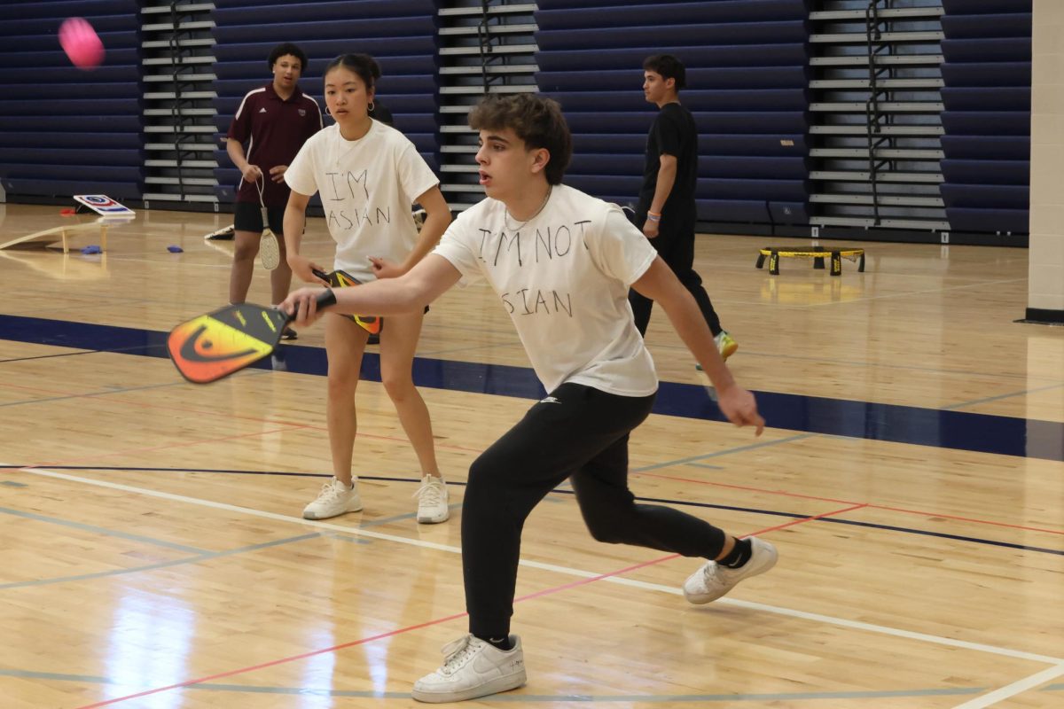 Junior Maddie Vinh and senior Korvin Brown participate in their first game of the tournament.