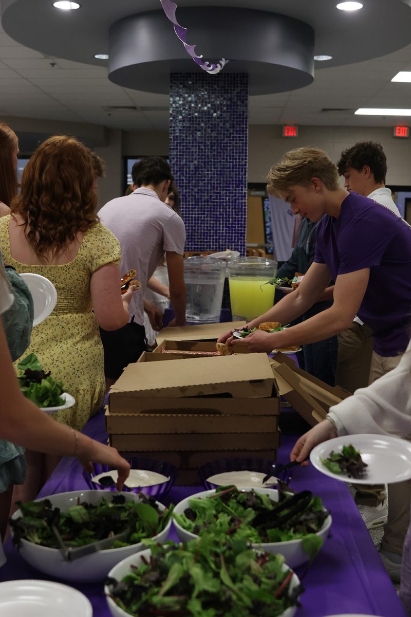 Kicking off the banquet, members of Relay For Life get pizza and salad for dinner Thursday April 24.
